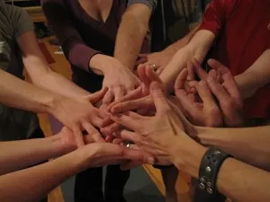 Hands working together